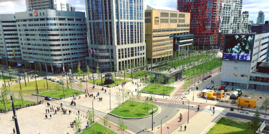 Photo of a busy square in a city.