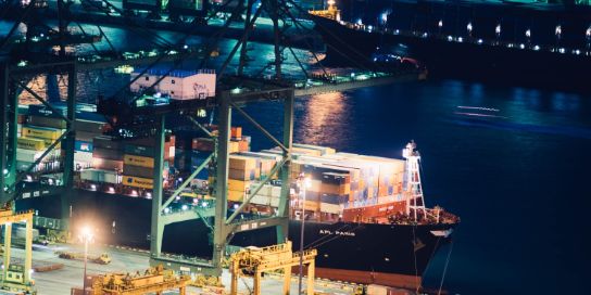 Photo of a container ship in a port.
