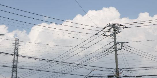 A pole with many power cables.