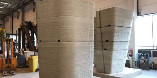 A photo of 2 big objects, made with 3D Concrete Printing.