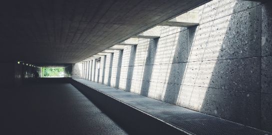 A photo of a tunnel. The tunnel is made from concrete.