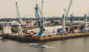 A port with containers and cranes.
