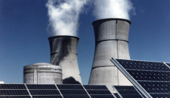 Solar panels and 2 large tubes from which steam/smoke comes out.