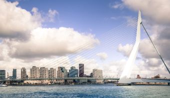 A photo of the Erasmus Bridge in Rotterdam on a sunny day.